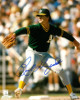 Rick Honeycutt signed Oakland Athletics 8x10 Photo (green jersey pitching)