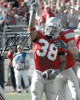 Brandon Joe signed Ohio State Buckeyes 8X10 Photo #38 (red jersey)